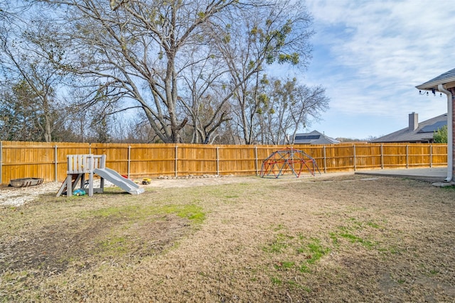 view of yard featuring a playground