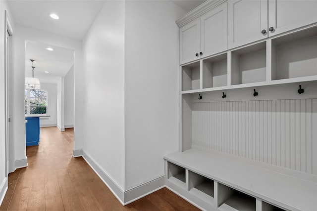 mudroom with an inviting chandelier, baseboards, dark wood finished floors, and recessed lighting