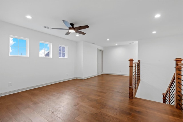 unfurnished room with ceiling fan, wood finished floors, visible vents, and recessed lighting