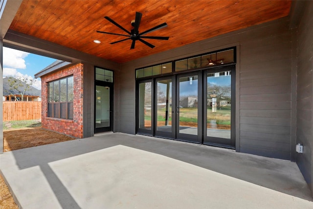 view of patio with a ceiling fan, french doors, and fence