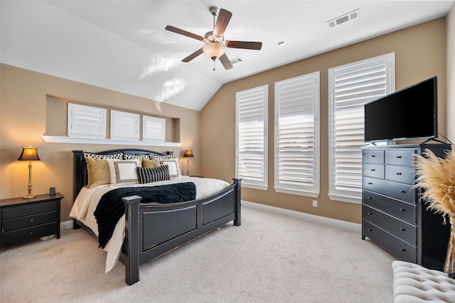 bedroom featuring lofted ceiling, light colored carpet, and ceiling fan