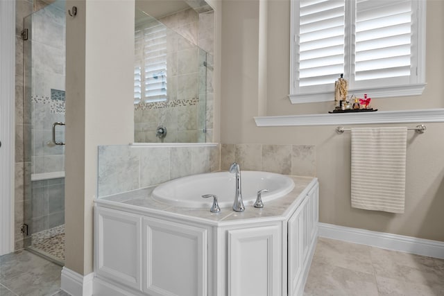 bathroom with plus walk in shower and tile patterned floors