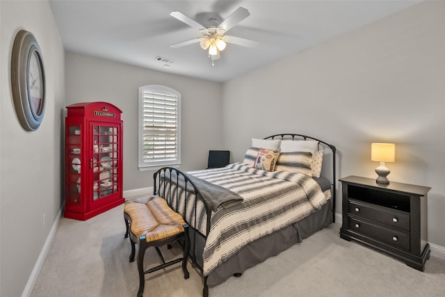 bedroom with light carpet and ceiling fan