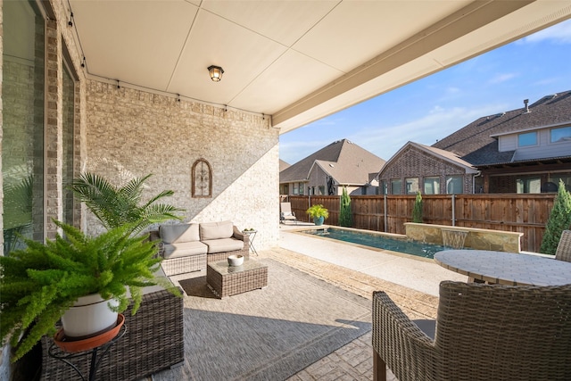 view of patio / terrace featuring outdoor lounge area and a fenced in pool