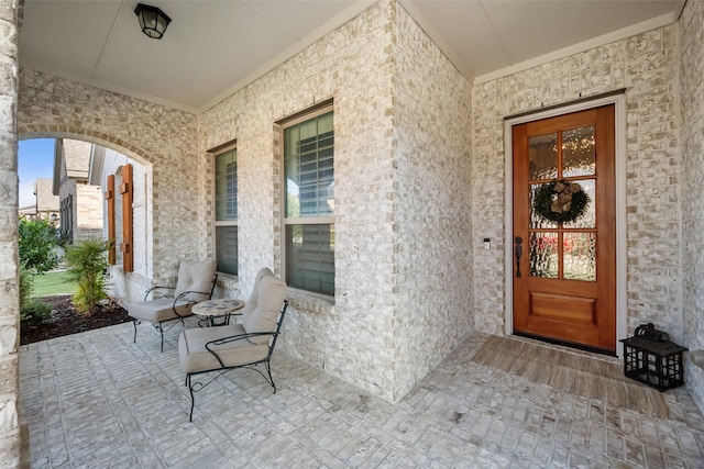 entrance to property featuring covered porch