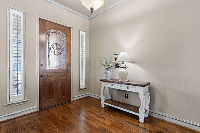 foyer featuring crown molding and dark wood-type flooring