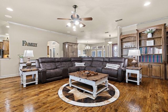 living room featuring dark wood-type flooring, ceiling fan, and crown molding