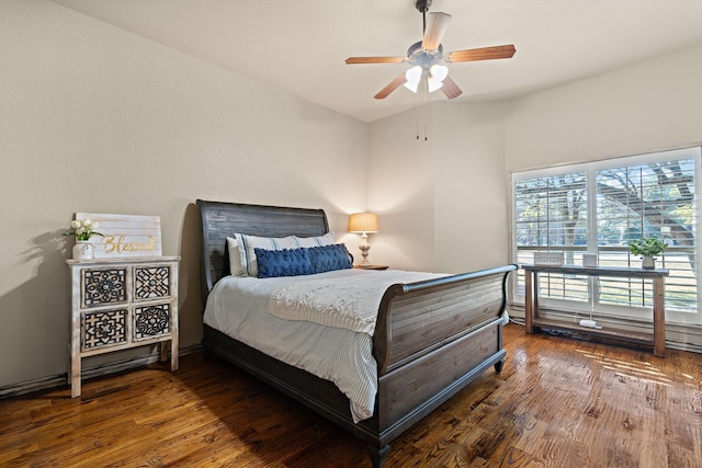 bedroom featuring ceiling fan and dark hardwood / wood-style floors