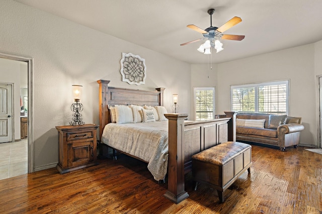 bedroom featuring ceiling fan and dark hardwood / wood-style floors