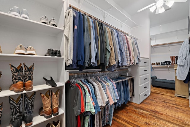 spacious closet with ceiling fan and hardwood / wood-style floors