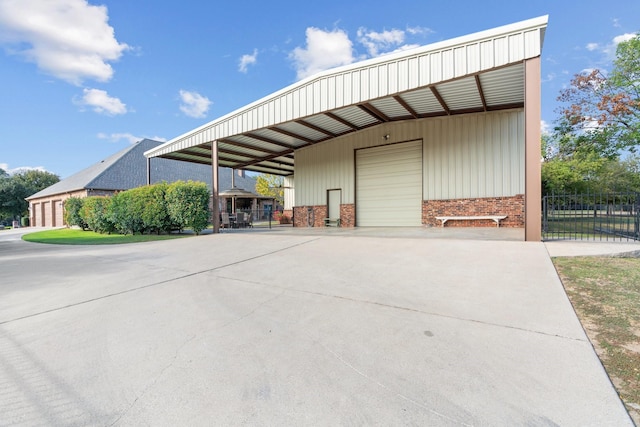 view of side of home with a garage and an outdoor structure