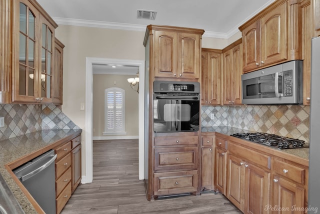 kitchen with stainless steel appliances, crown molding, tasteful backsplash, and light hardwood / wood-style flooring