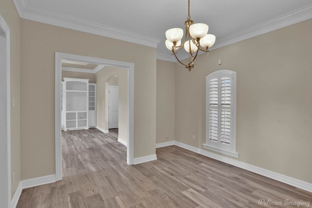 interior space with crown molding, a chandelier, and light hardwood / wood-style flooring