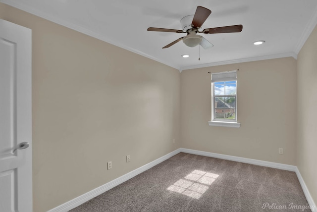 spare room with crown molding, ceiling fan, and carpet