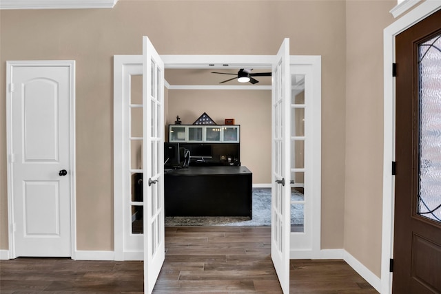 entrance foyer with french doors, ceiling fan, and dark wood-type flooring