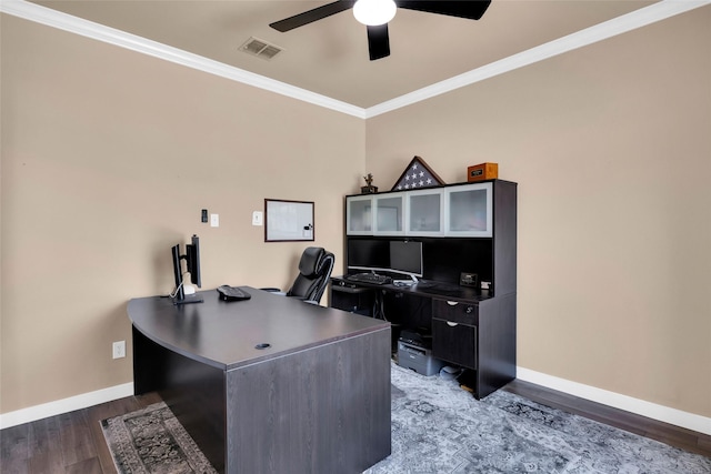 office featuring dark wood-type flooring, ornamental molding, and ceiling fan