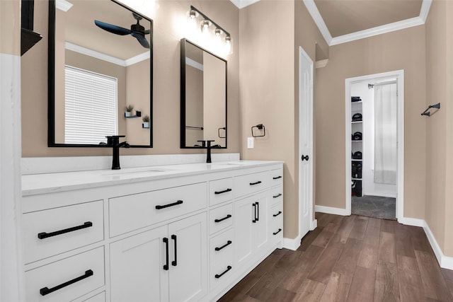 bathroom with vanity, crown molding, ceiling fan, and hardwood / wood-style flooring