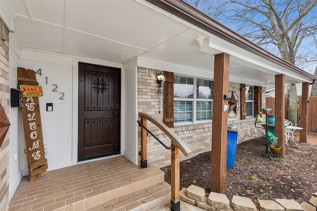 doorway to property with covered porch