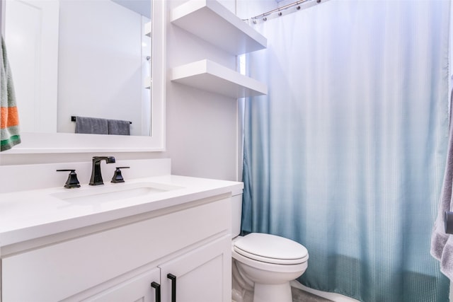 full bathroom with vanity, shower / bath combination with curtain, and toilet