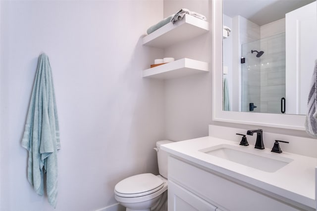 bathroom featuring walk in shower, vanity, and toilet