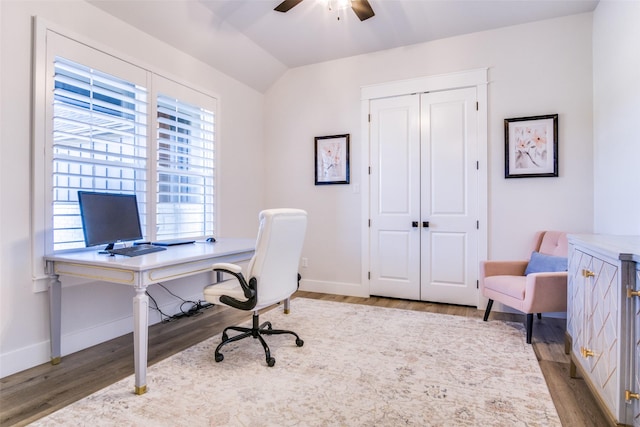 office with wood-type flooring, vaulted ceiling, and ceiling fan