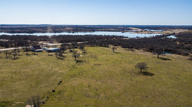 birds eye view of property featuring a water view and a rural view