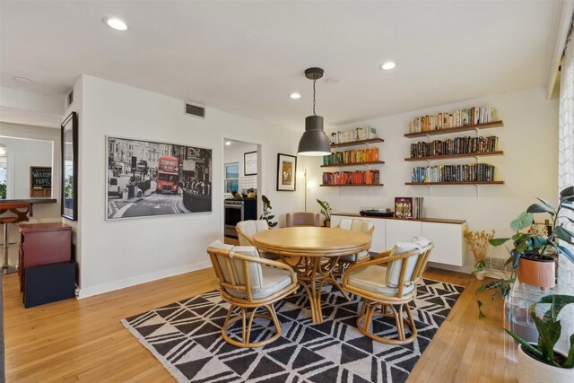 living room with light hardwood / wood-style flooring