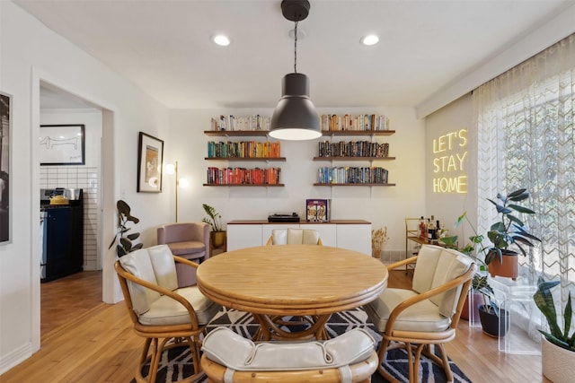 dining space featuring light hardwood / wood-style floors