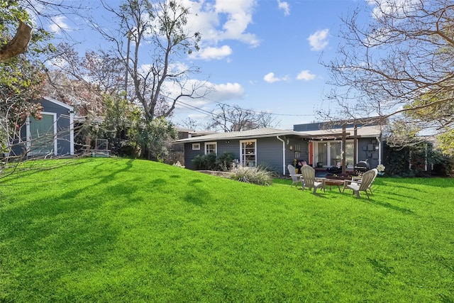 view of yard with a fire pit