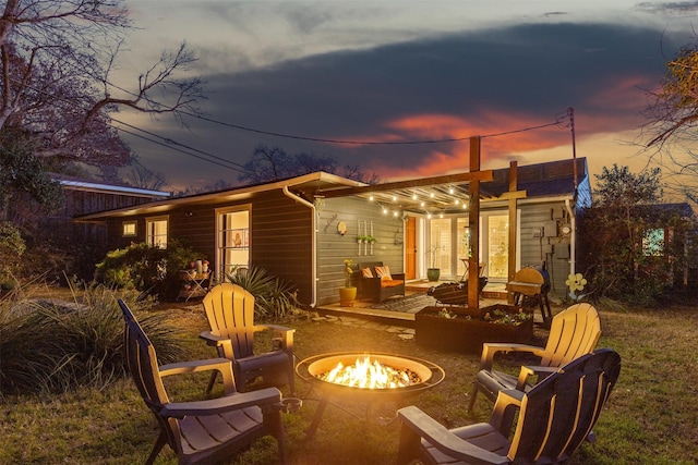 exterior space featuring an outdoor fire pit