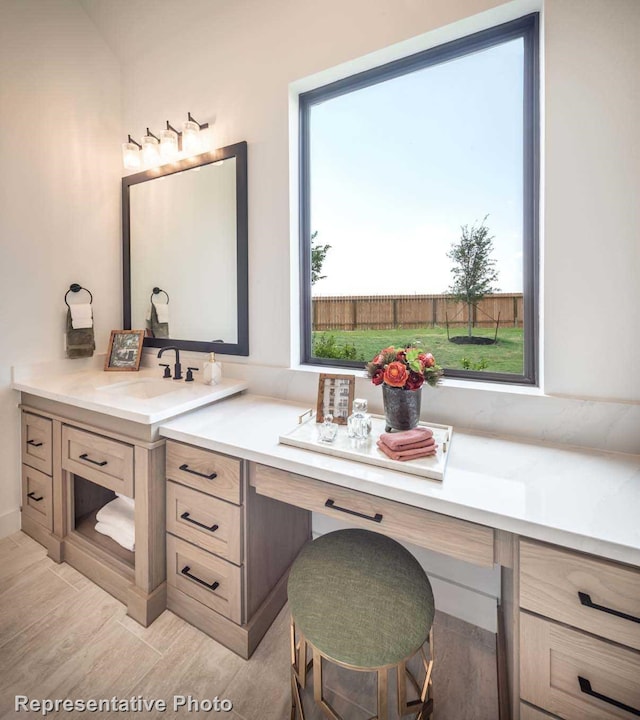 bathroom with vanity and hardwood / wood-style floors