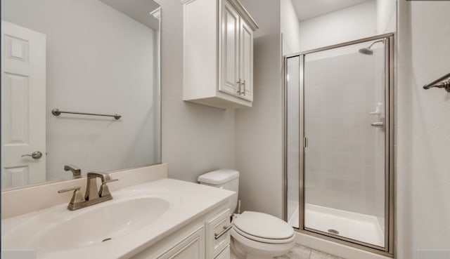 bathroom with vanity, toilet, and an enclosed shower