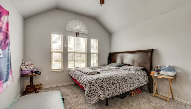 carpeted bedroom featuring vaulted ceiling