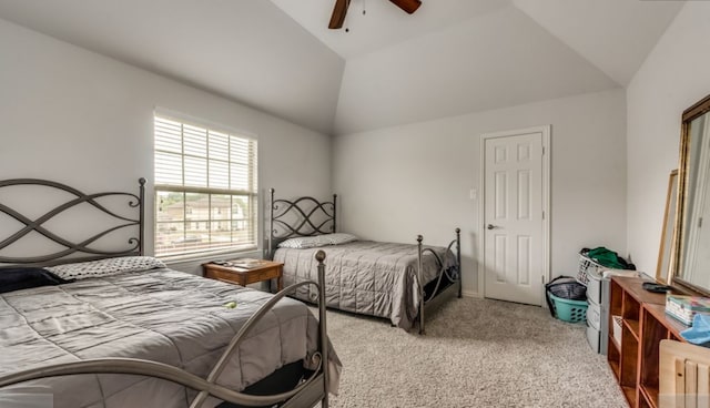 carpeted bedroom featuring ceiling fan and vaulted ceiling