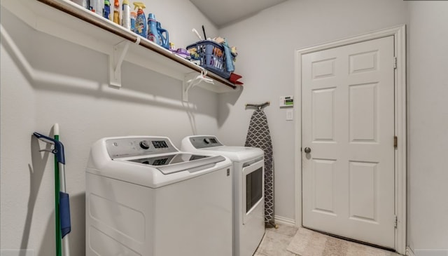 laundry room featuring washer and clothes dryer