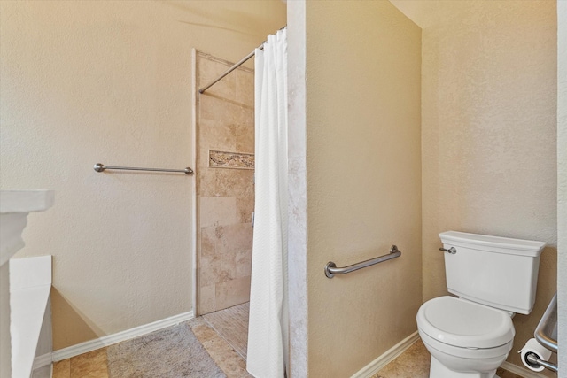 bathroom with toilet, tile patterned flooring, and a shower with shower curtain