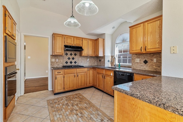 kitchen with light tile patterned floors, sink, hanging light fixtures, and black appliances