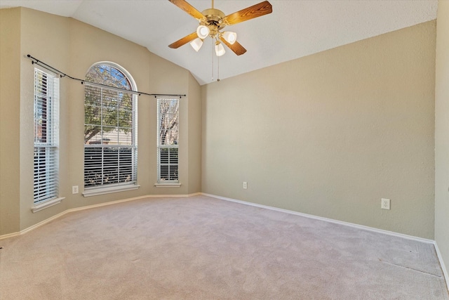 unfurnished room featuring lofted ceiling, light colored carpet, and ceiling fan