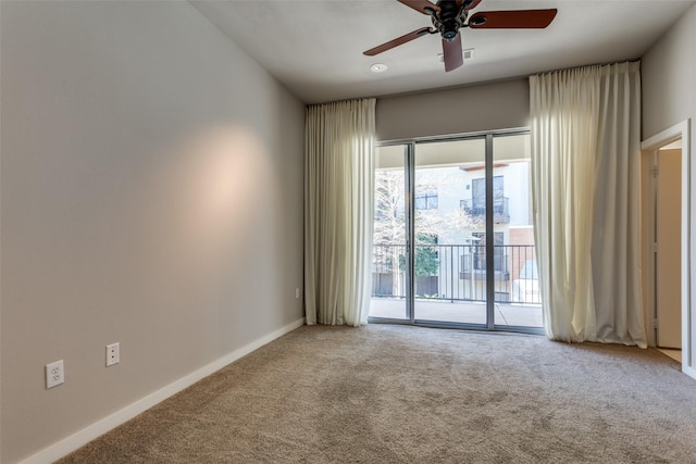 spare room with ceiling fan and carpet flooring