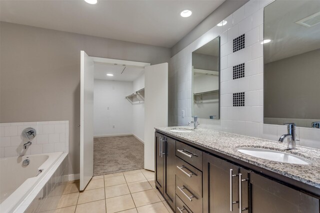 full bathroom with tiled shower / bath combo, sink, and toilet