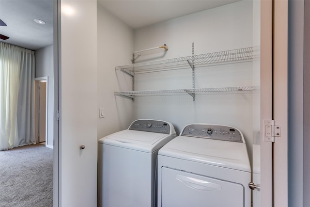 washroom with carpet floors and washer and clothes dryer