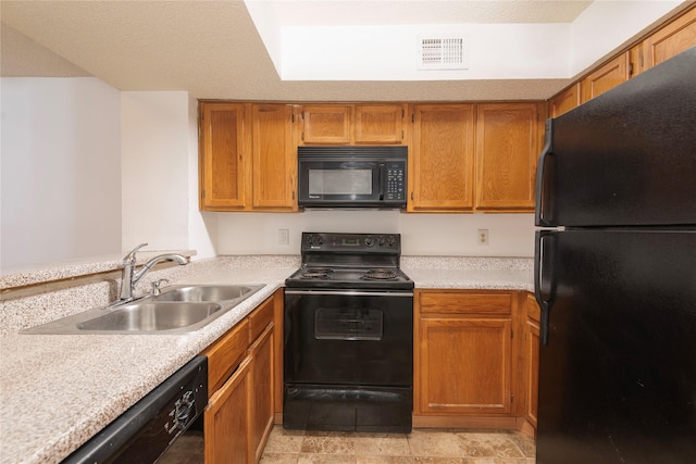 kitchen featuring sink and black appliances