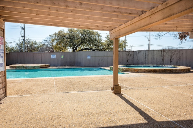 view of pool with an in ground hot tub, a patio, and a pergola