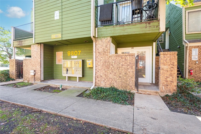 doorway to property with a balcony