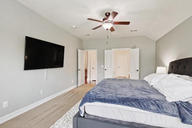 carpeted bedroom featuring lofted ceiling and ceiling fan