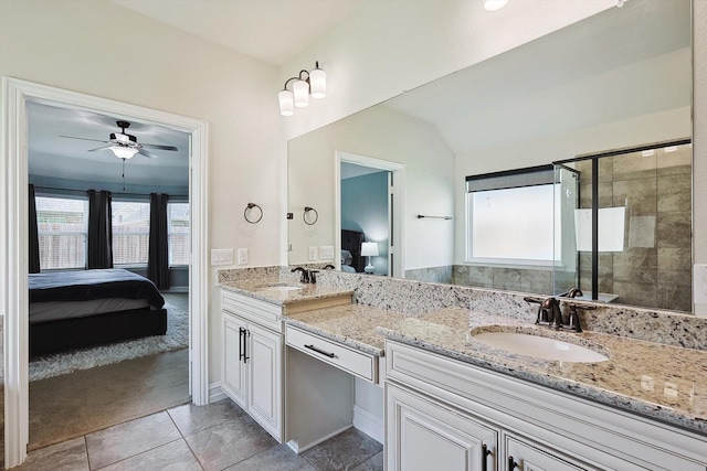 bathroom with vanity, plenty of natural light, ceiling fan, and walk in shower