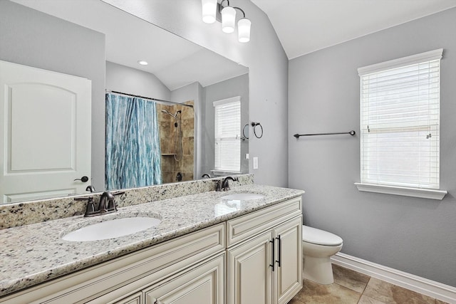 bathroom featuring tile patterned flooring, vanity, vaulted ceiling, toilet, and walk in shower