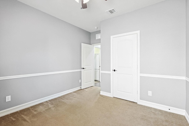 unfurnished bedroom with light colored carpet and ceiling fan