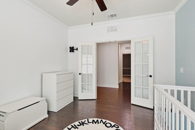 bedroom with ornamental molding, dark hardwood / wood-style floors, ceiling fan, and french doors