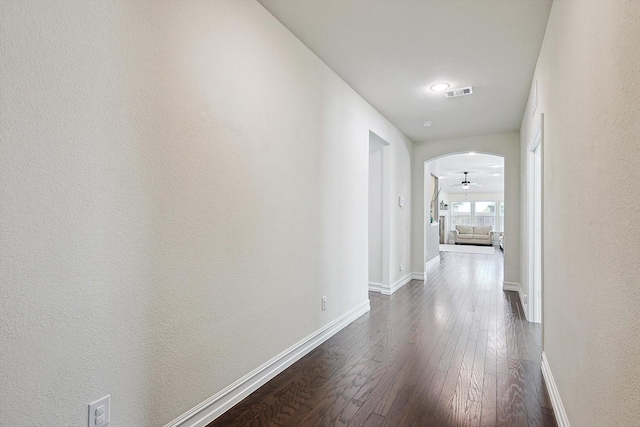 hallway featuring dark hardwood / wood-style flooring